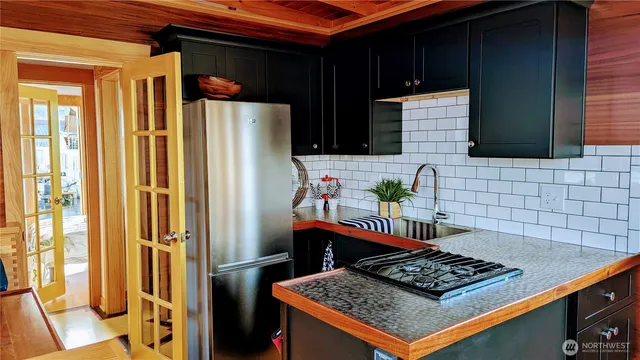 a bathroom with a toilet and a shower curtain