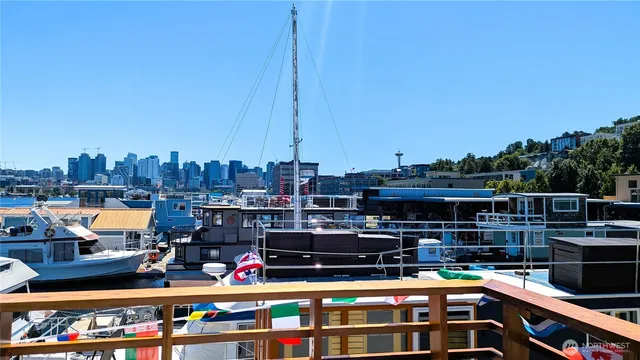 a living room with lots of furniture and kitchen view