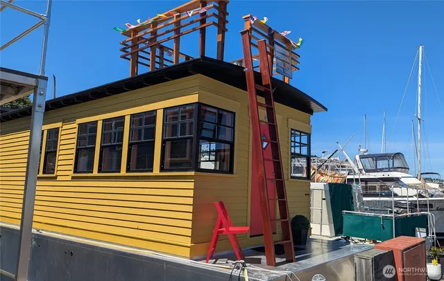 a living room filled with furniture and a potted plant