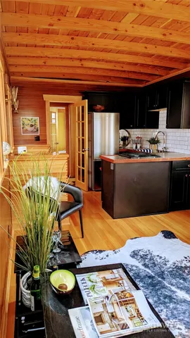 a kitchen with stainless steel appliances granite countertop a refrigerator and a stove
