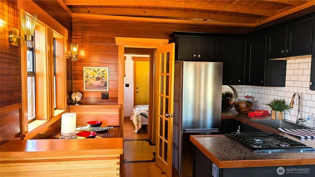 a white refrigerator freezer sitting inside of a kitchen