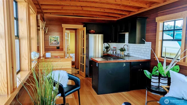 a view of staircase with a chair and a potted plant