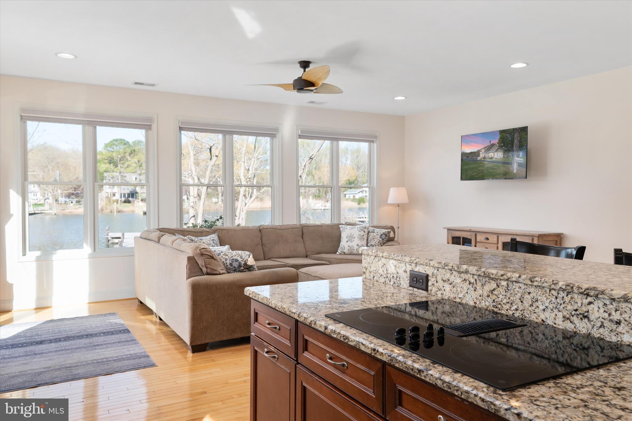 5936 Sneed Drive Deale, MD 20751 - Photo 59 of 59 a kitchen with granite countertop a sink and a stove top oven