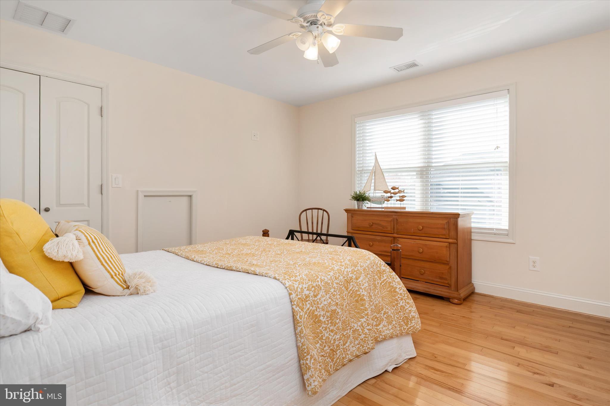 5936 Sneed Drive Deale, MD 20751 - Photo 25 of 59 a bedroom with a bed and a chandelier