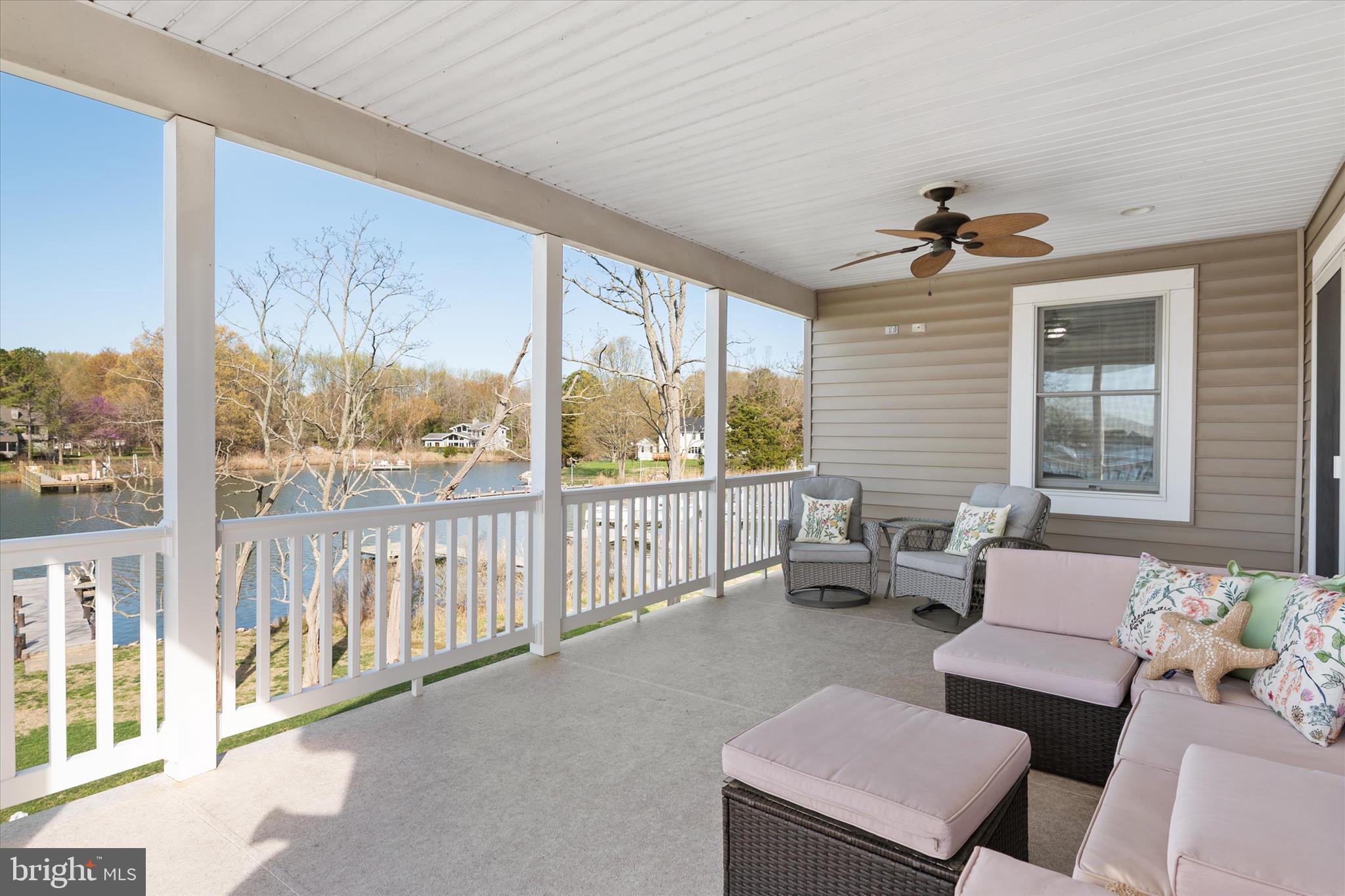 5936 Sneed Drive Deale, MD 20751 - Photo 29 of 59 a living room with furniture and a floor to ceiling window