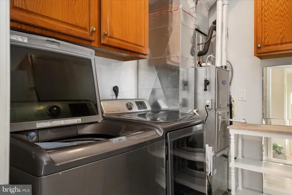 a view of a lake with couches chairs and a table