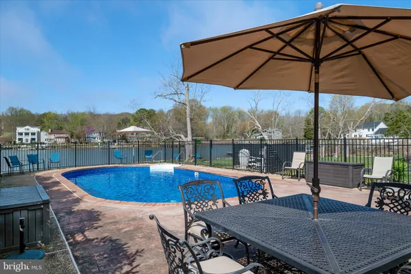 a view of a swimming pool with a patio