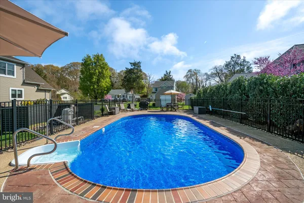 an aerial view of a swimming pool patio and mountain view