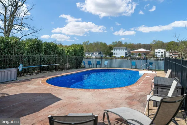 an aerial view of a house with a lake view