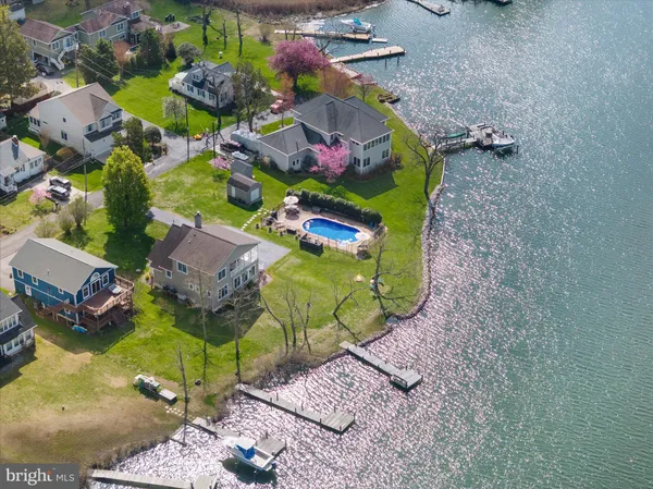 an aerial view of a house with a swimming pool