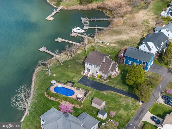 an aerial view of a house with yard swimming pool and outdoor seating