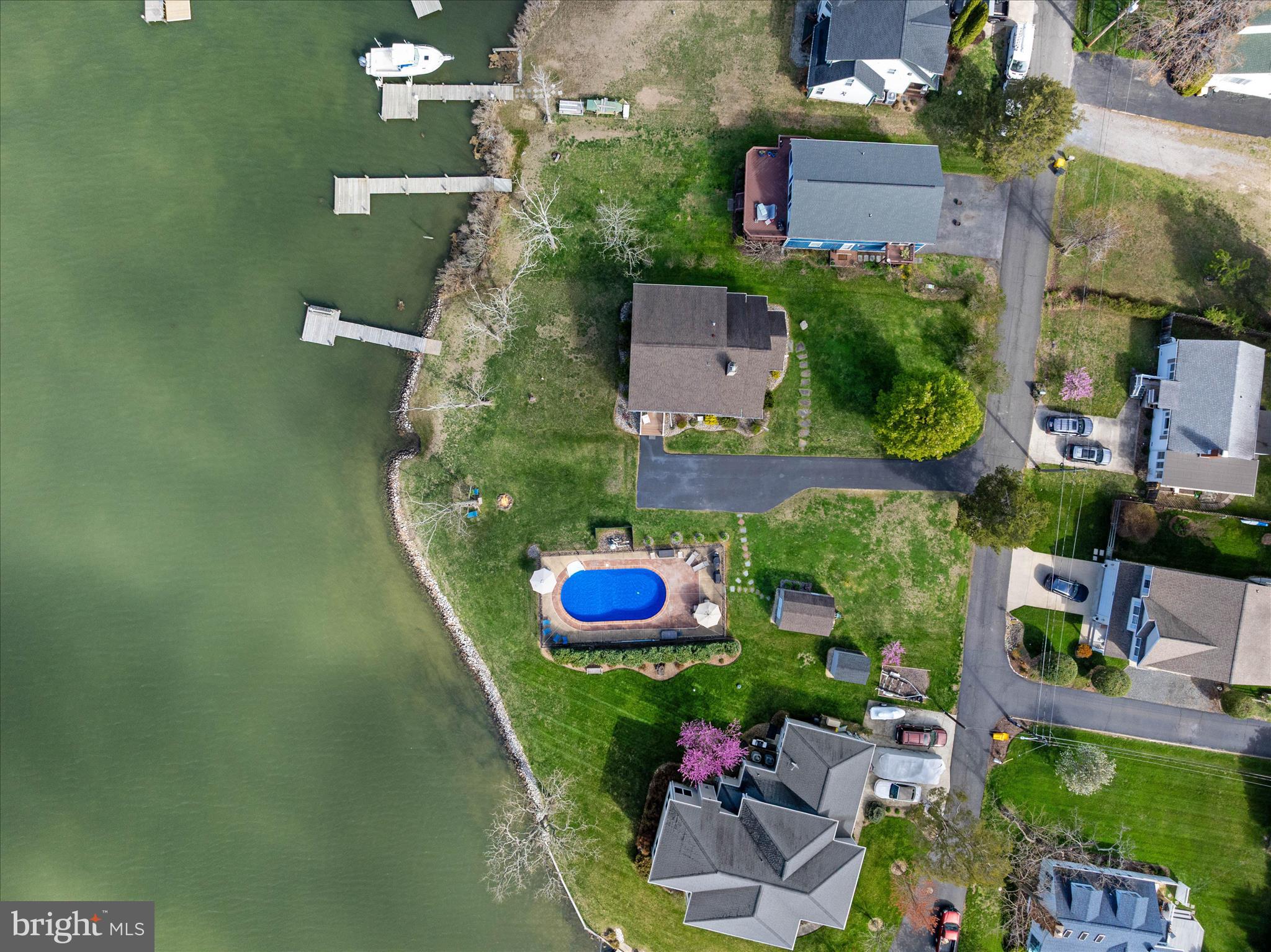 5936 Sneed Drive Deale, MD 20751 - Photo 45 of 59 an aerial view of a house with swimming pool outdoor seating and yard