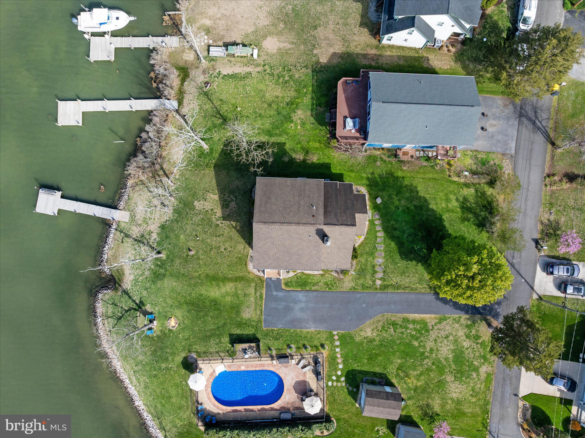 5936 Sneed Drive Deale, MD 20751 - Photo 47 of 59 an aerial view of a house with yard swimming pool and outdoor seating