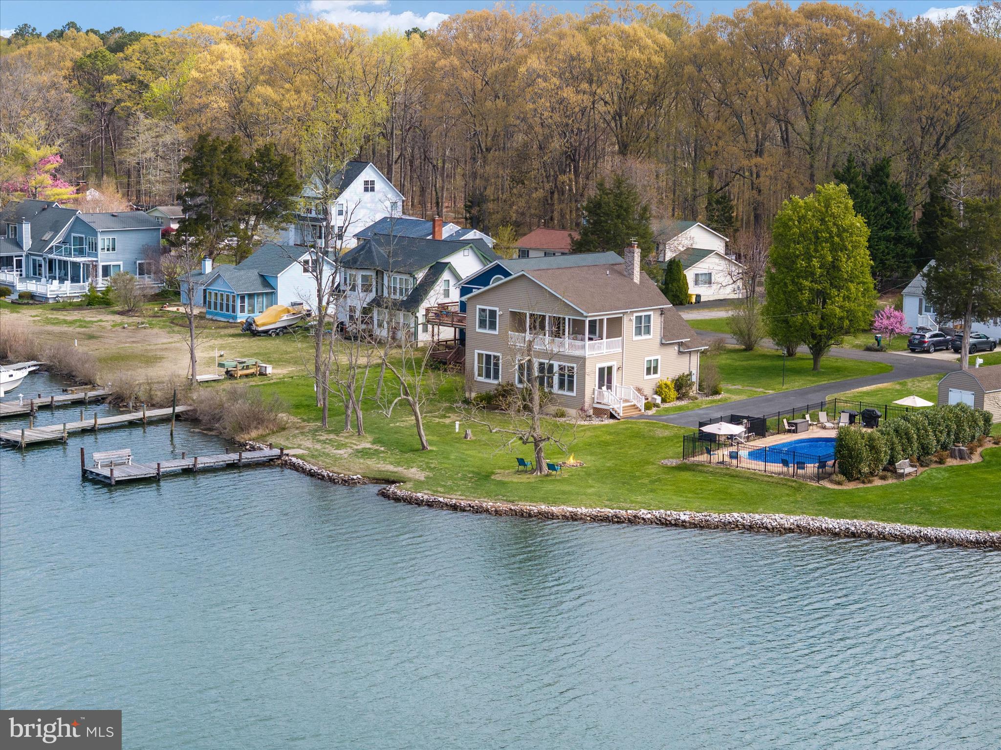 5936 Sneed Drive Deale, MD 20751 - Photo 51 of 59 an aerial view of a house with a yard and lake view