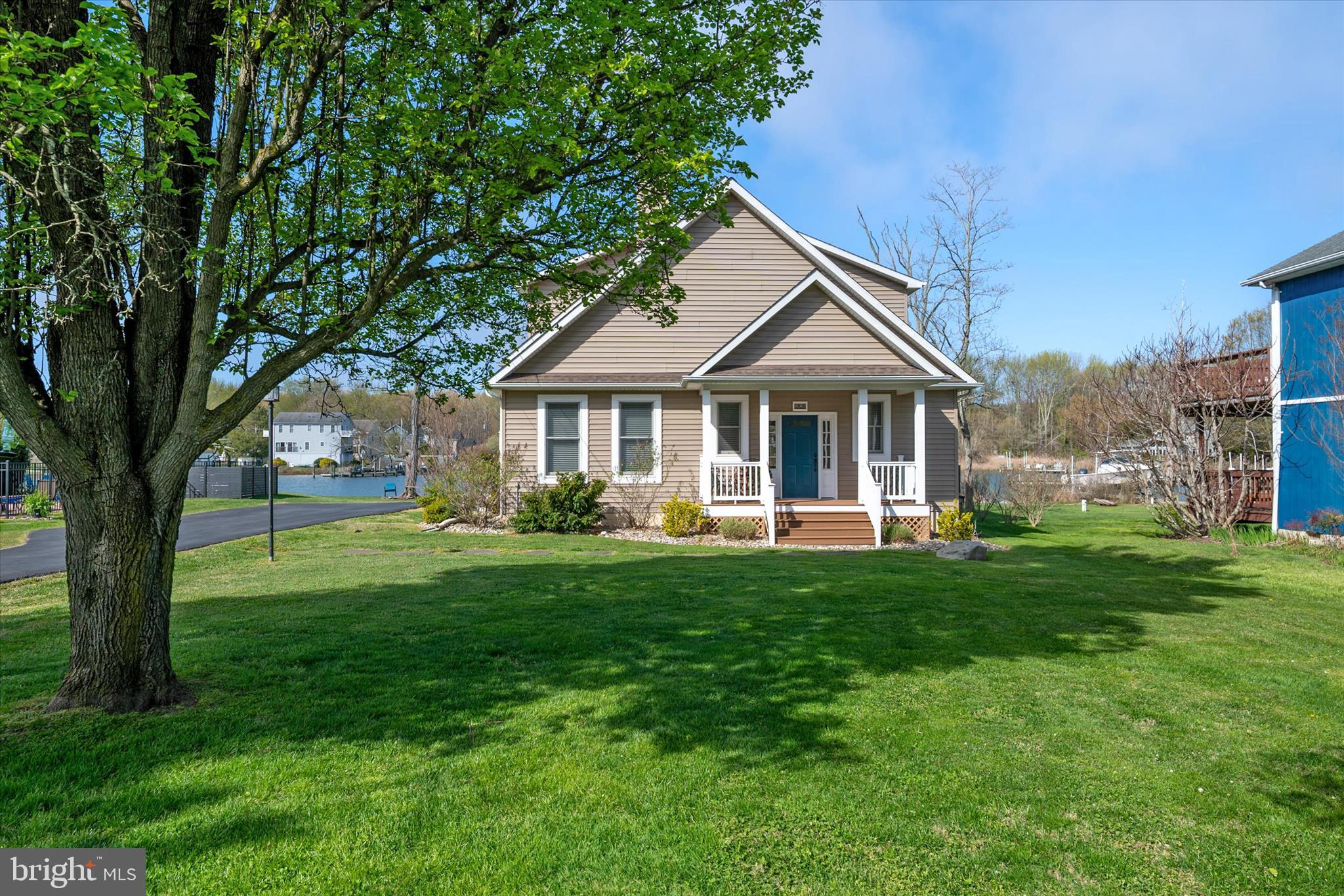 5936 Sneed Drive Deale, MD 20751 - Photo 52 of 59 a front view of a house with a yard