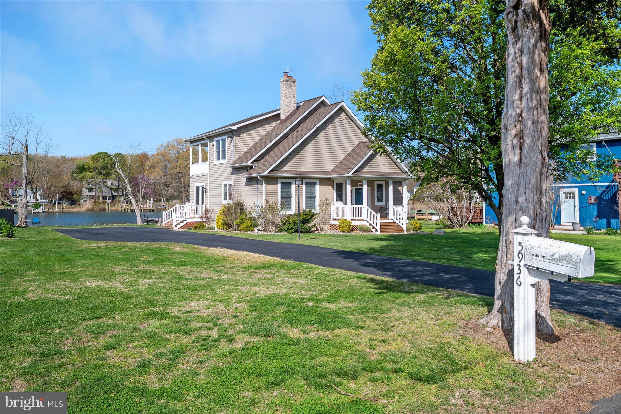 5936 Sneed Drive Deale, MD 20751 - Photo 53 of 59 a front view of a house with a yard table and chairs