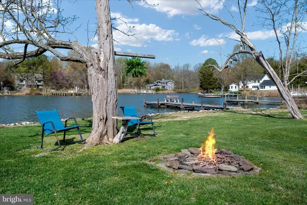 a front view of a house with garden and porch