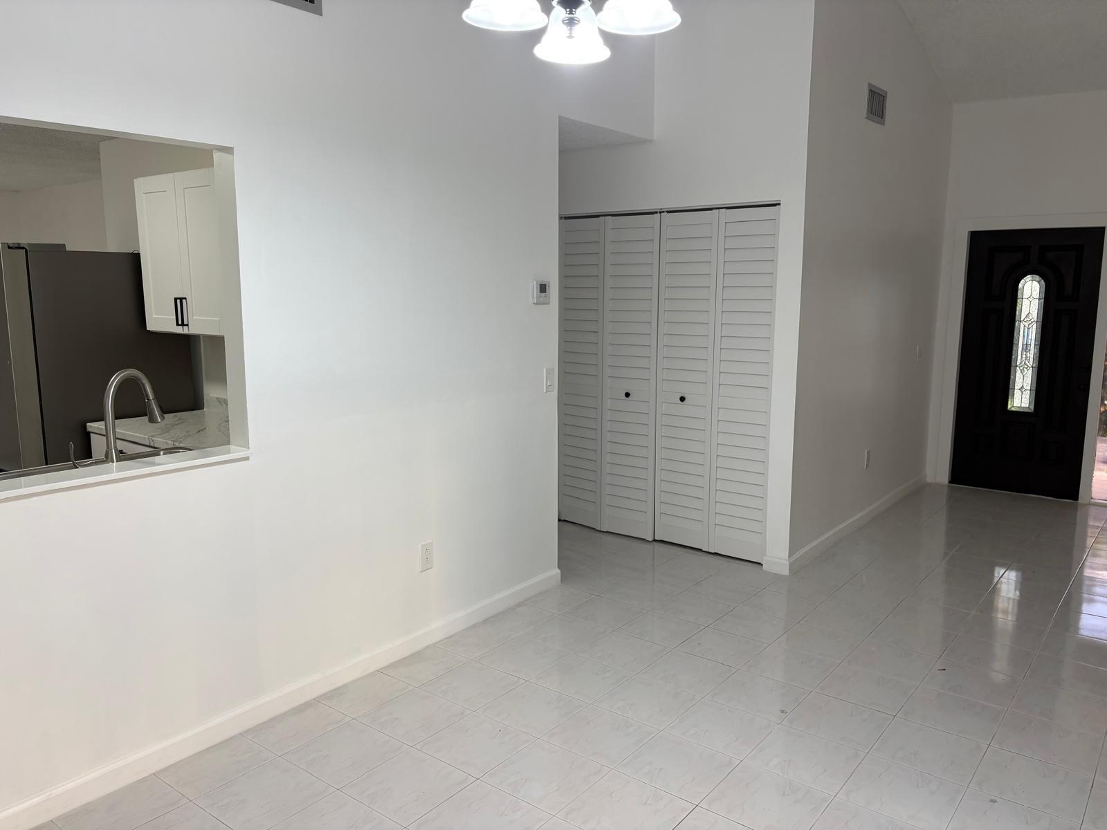 12231 Southwest 210th Street Miami, FL 33177 - Photo 12 of 38 an empty room with closet area