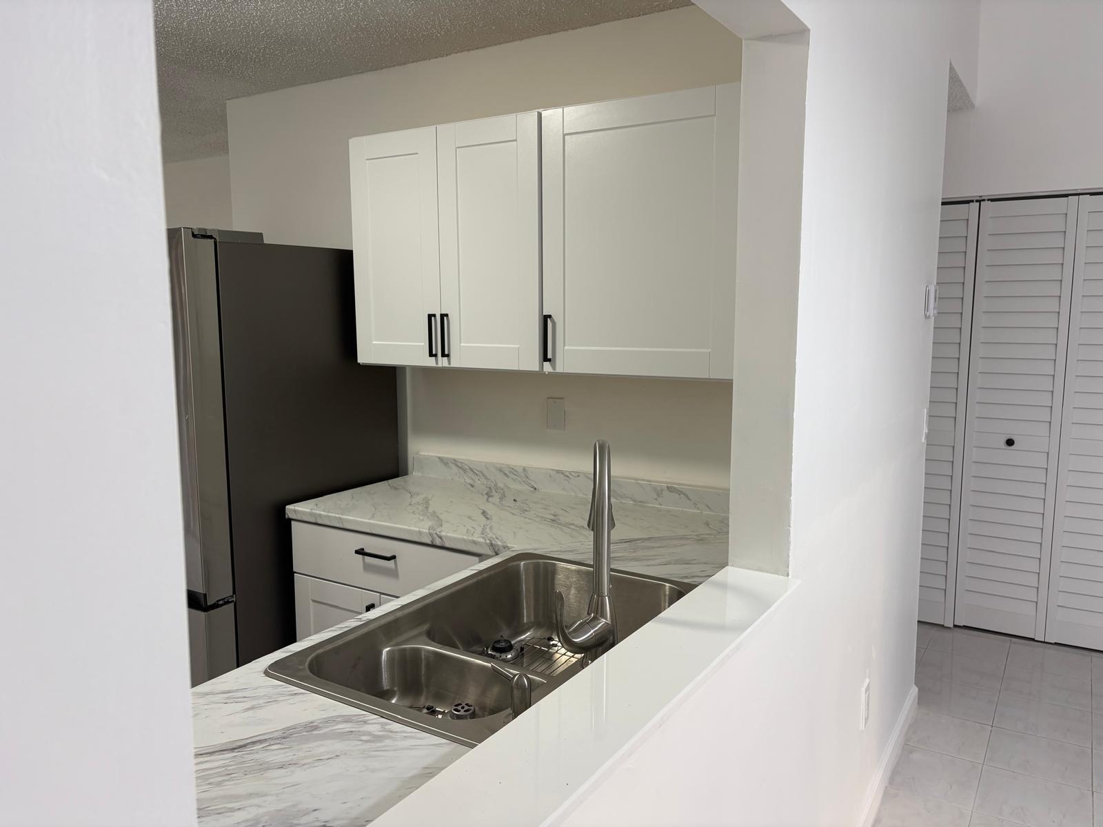 12231 Southwest 210th Street Miami, FL 33177 - Photo 13 of 38 a utility room with washer and dryer