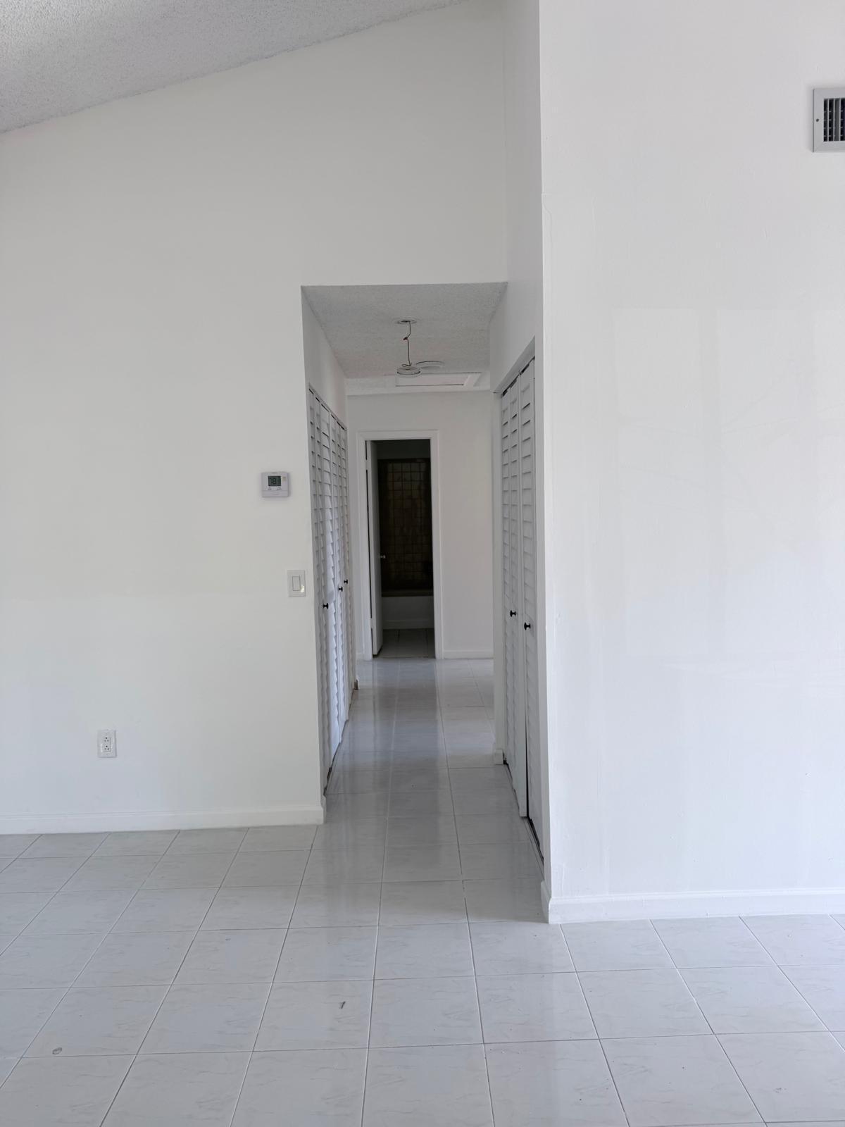 12231 Southwest 210th Street Miami, FL 33177 - Photo 14 of 38 a view of a hallway