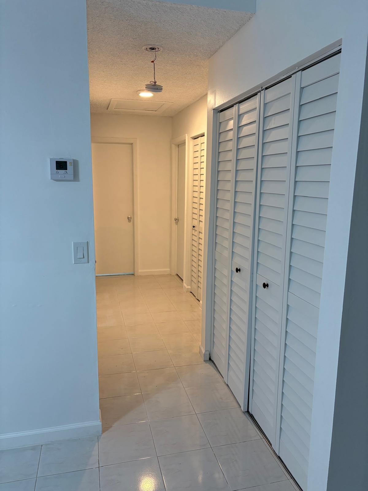 12231 Southwest 210th Street Miami, FL 33177 - Photo 15 of 38 a view of hallway with shower