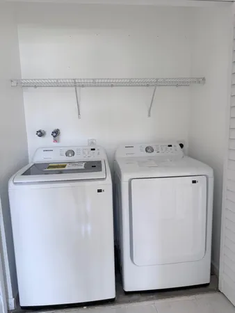 a utility room with dryer and washer