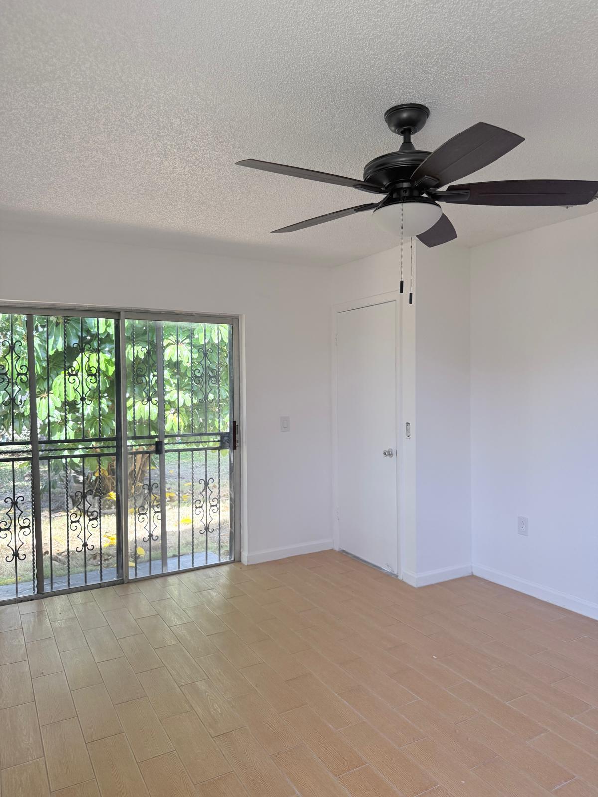 12231 Southwest 210th Street Miami, FL 33177 - Photo 28 of 38 a view of an empty room with a window