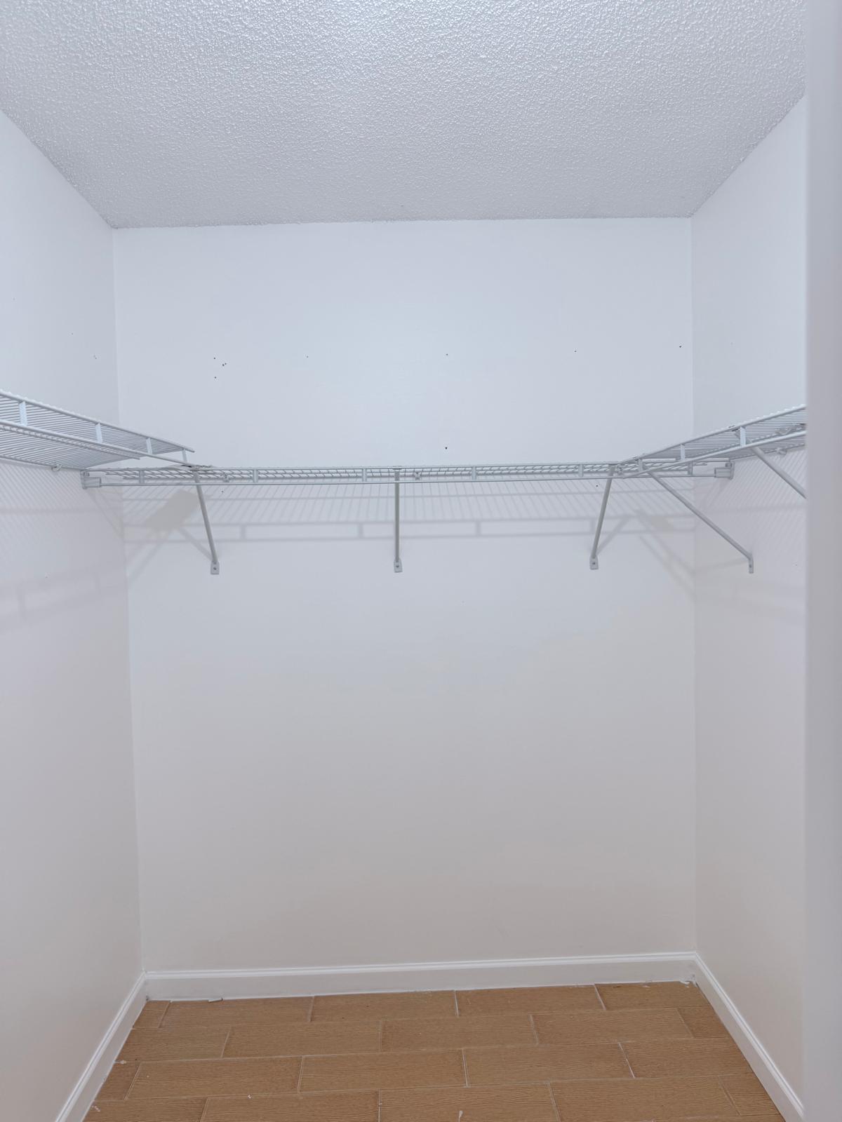 12231 Southwest 210th Street Miami, FL 33177 - Photo 30 of 38 a view of a room with racks on the wall