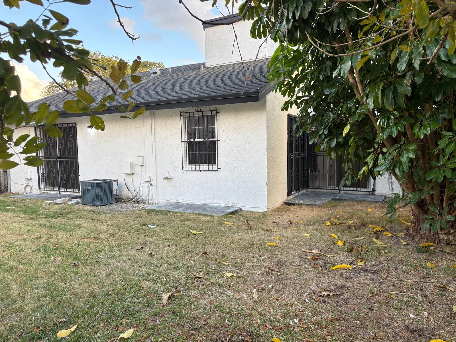 12231 Southwest 210th Street Miami, FL 33177 - Photo 35 of 38 a house view with a outdoor space