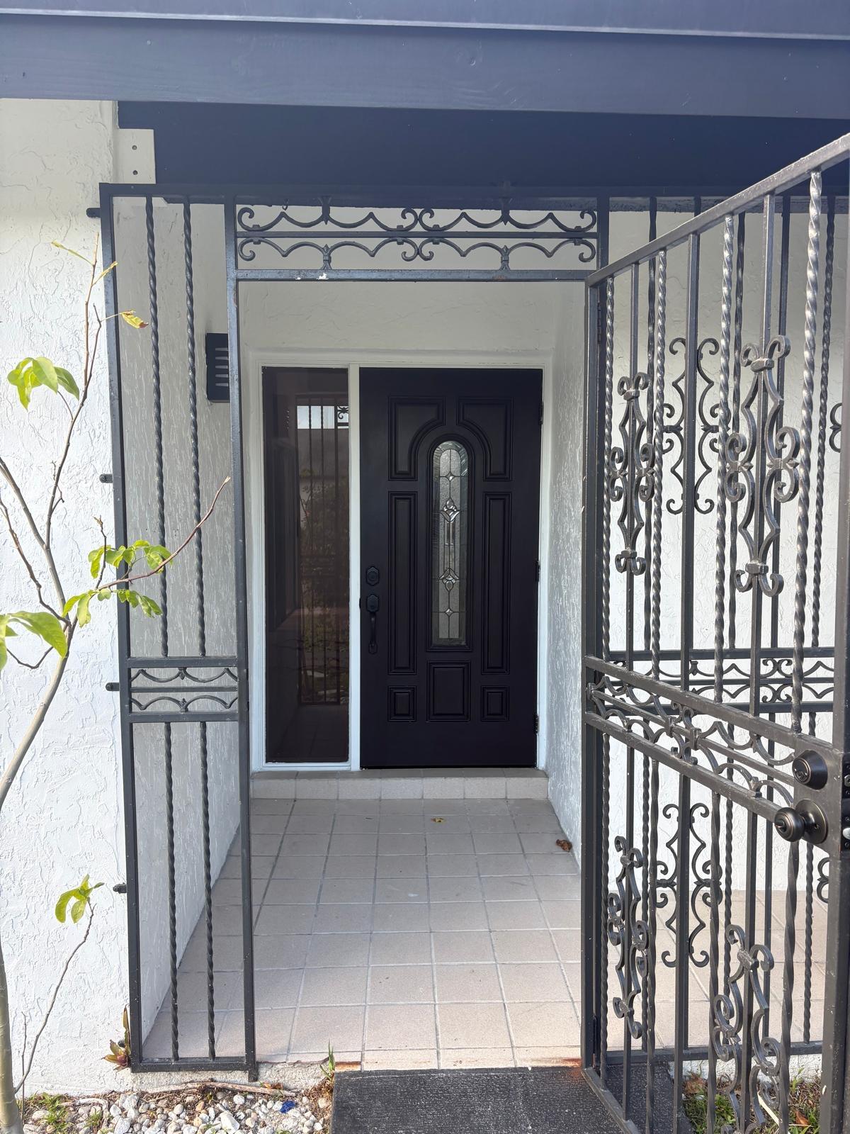 12231 Southwest 210th Street Miami, FL 33177 - Photo 7 of 38 a view of entryway with a front door