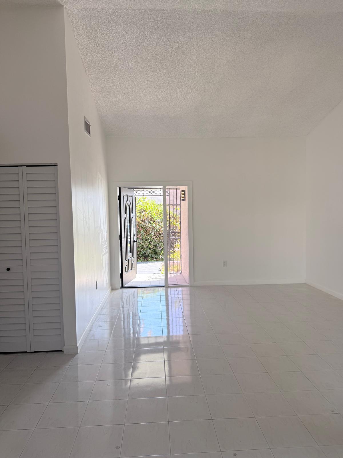12231 Southwest 210th Street Miami, FL 33177 - Photo 10 of 38 an empty room with windows