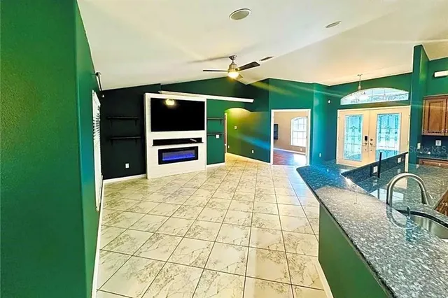 a swimming pool with a large window and balcony