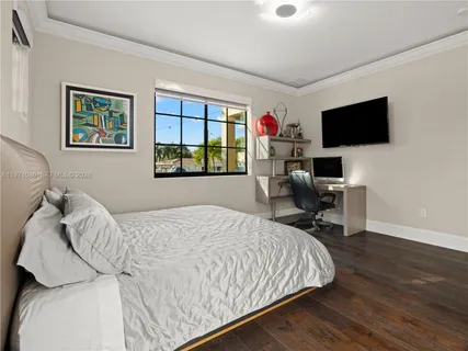 a bedroom with a bed and a table in it