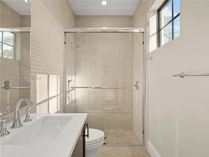 a bathroom with a sink double vanity and a mirror
