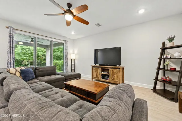 a bed sitting in a room next to a window