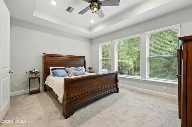 a bedroom with a bed and dresser