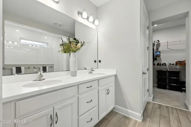 a view of a grassy field with trees