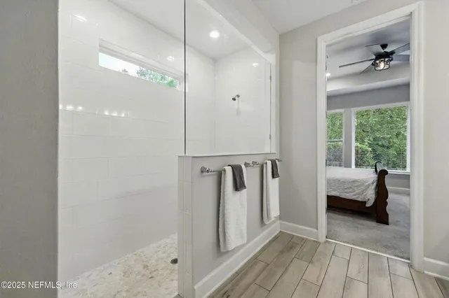 a green field with lots of trees