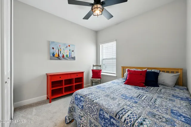 an aerial view of a house with yard