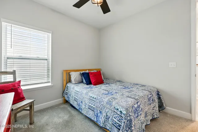 an aerial view of a house with pool yard and outdoor seating