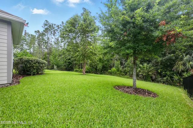 a view of a swimming pool with a table and chairs