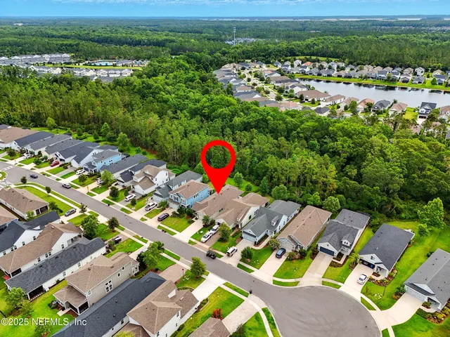 a view of a house with yard and tree s