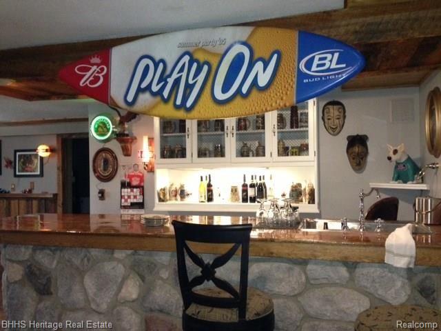 7546 West Sherwood Road Fowlerville, MI 48836 - Photo 22 of 32 Another bar picture - professional stonework
