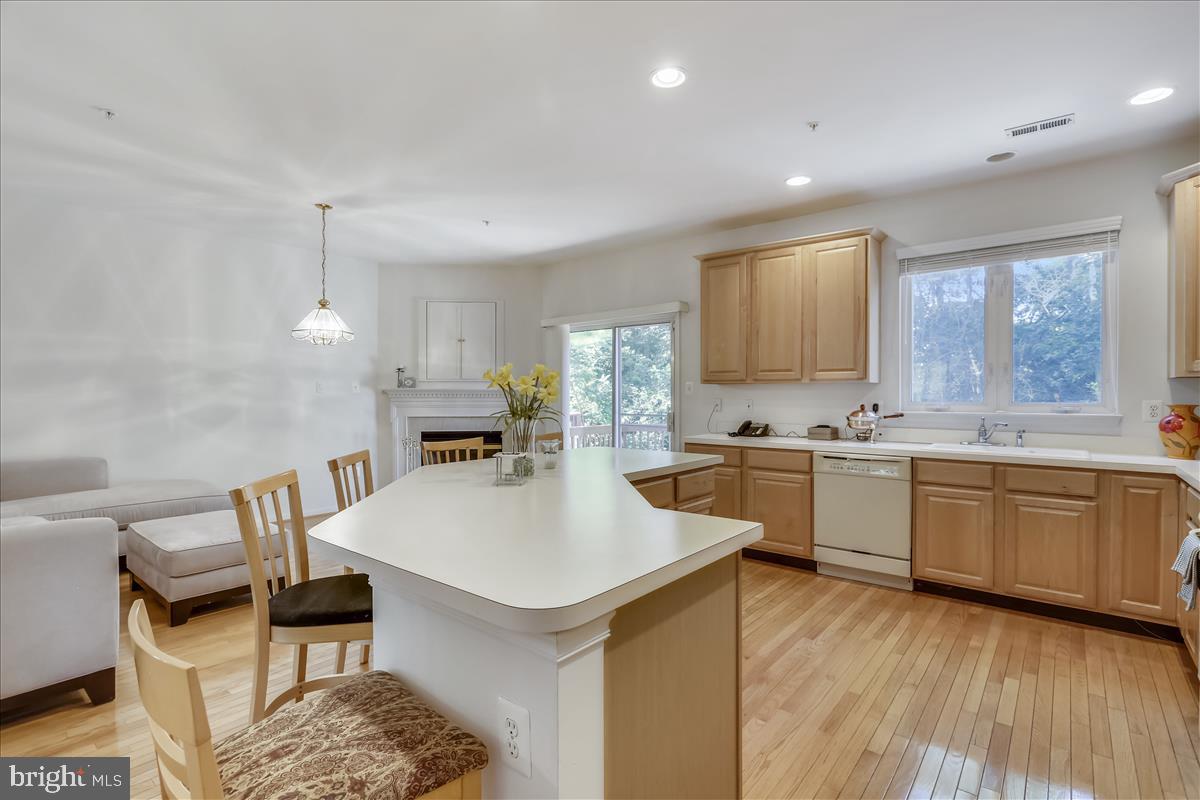 2908 St Helen Circle Silver Spring, MD 20906 - Photo 10 of 40 An oversized kitchen island and cozy fireplace