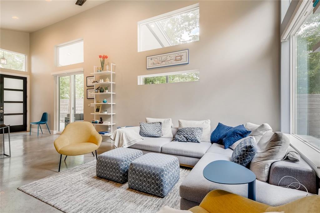 1142 Eleanor Street, Unit 2 Austin, TX 78721 - Photo 10 of 24 Lofty ceilings and a wall of glass illuminate this contemporary living space.