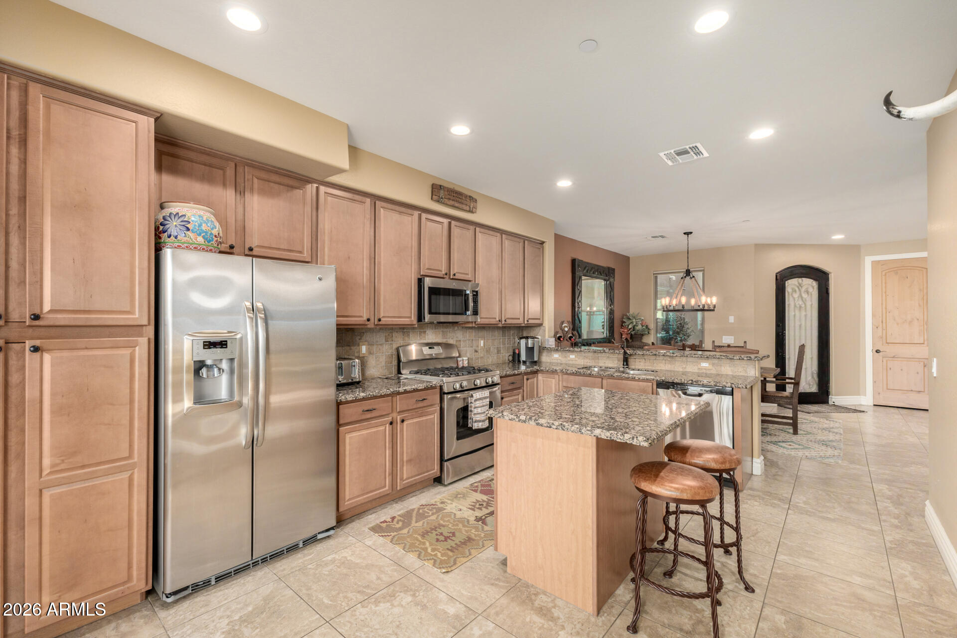 6434 East Military Road, Unit 102 Cave Creek, AZ 85331 - Photo 12 of 66 a kitchen with cabinets a sink and stainless steel appliances