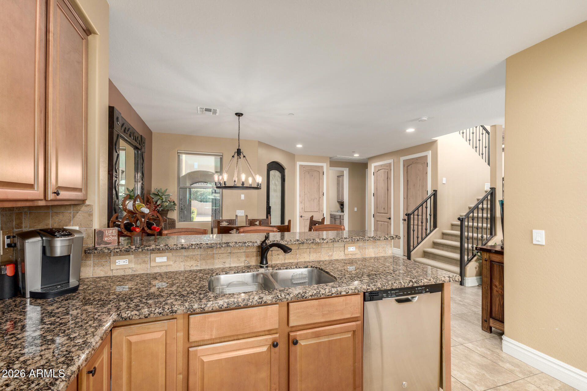 6434 East Military Road, Unit 102 Cave Creek, AZ 85331 - Photo 13 of 66 a kitchen with granite countertop a sink and a white stainless steel appliances