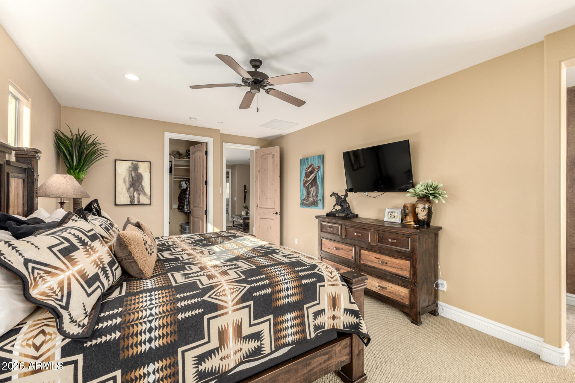 6434 East Military Road, Unit 102 Cave Creek, AZ 85331 - Photo 18 of 66 a bedroom with a bed and a flat screen tv