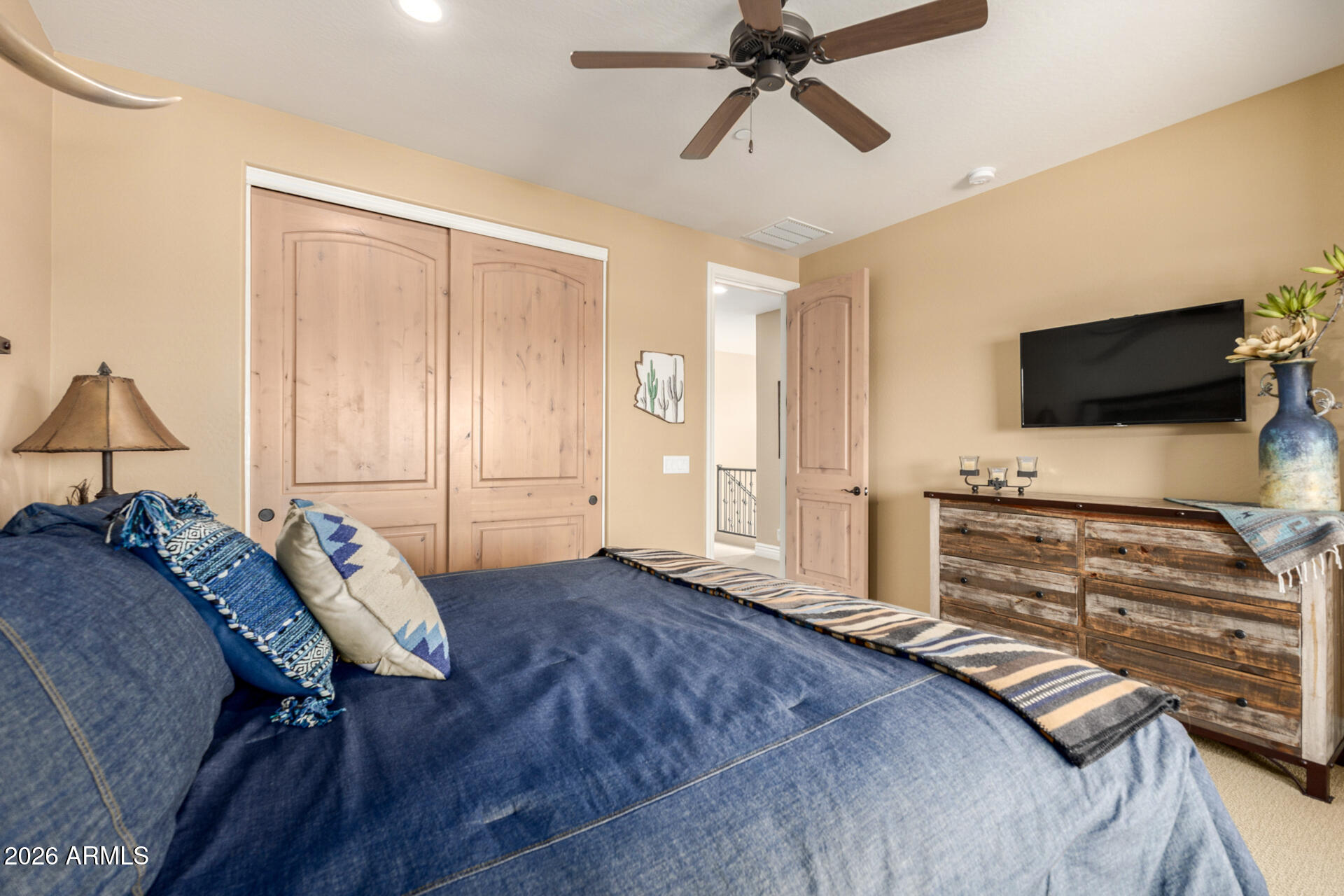 6434 East Military Road, Unit 102 Cave Creek, AZ 85331 - Photo 23 of 66 a bedroom with a bed and a flat screen tv