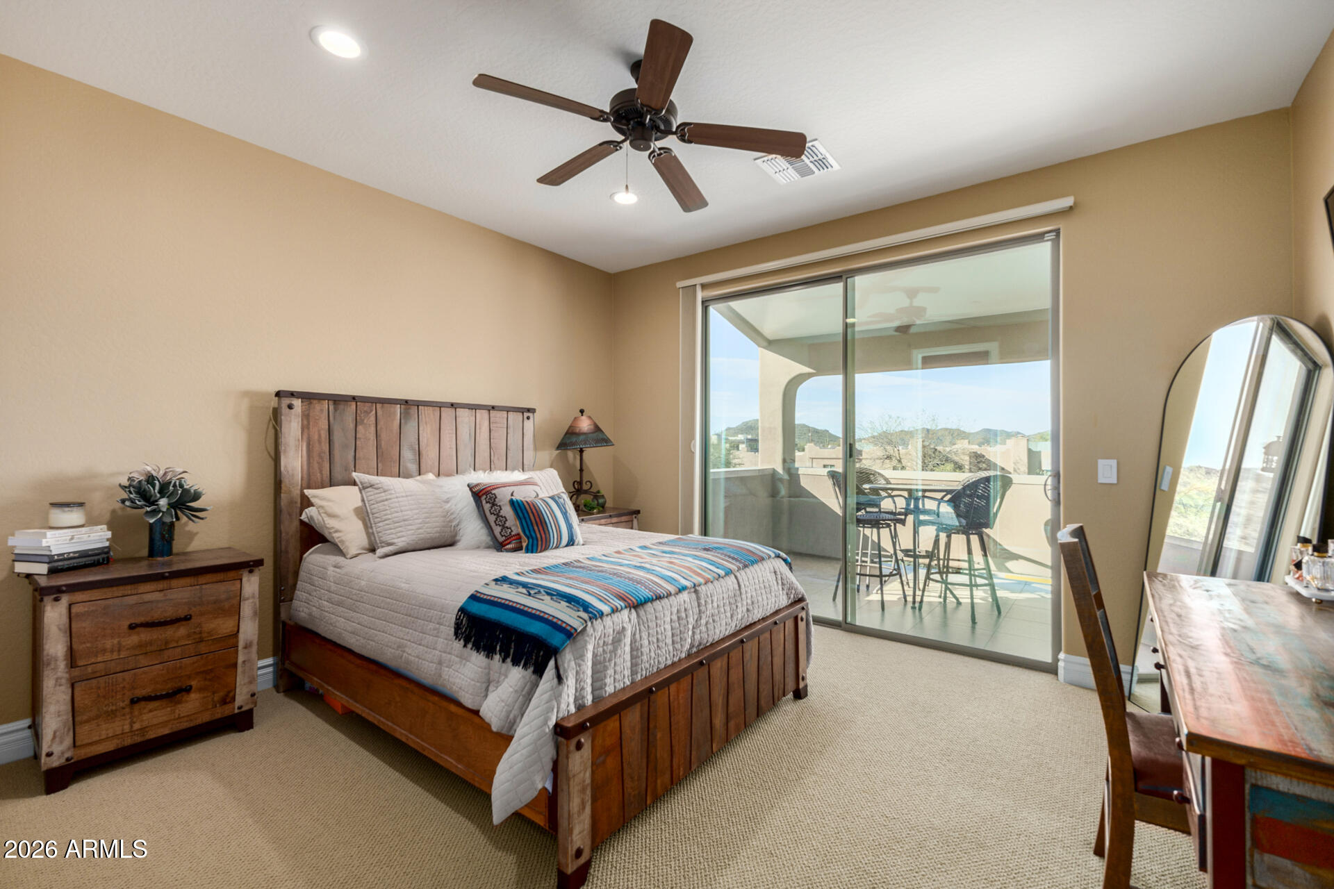 6434 East Military Road, Unit 102 Cave Creek, AZ 85331 - Photo 24 of 66 a bedroom with a bed a window and a chandelier